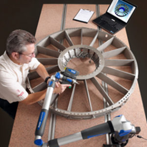 This employee is 3d scanning a wind turbine.